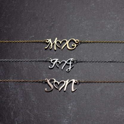 DOUBLE INITIAL HEART NECKLACE