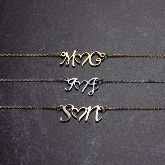 DOUBLE INITIAL HEART NECKLACE